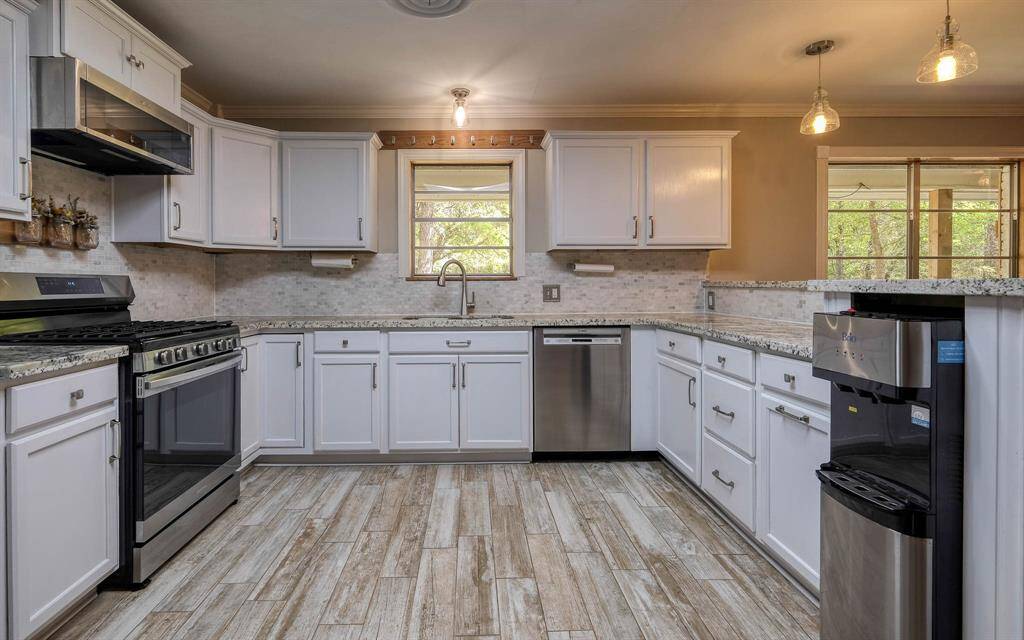 Kitchen with stainless appliances and granite countertops! Pantry is behind us not in the picture!