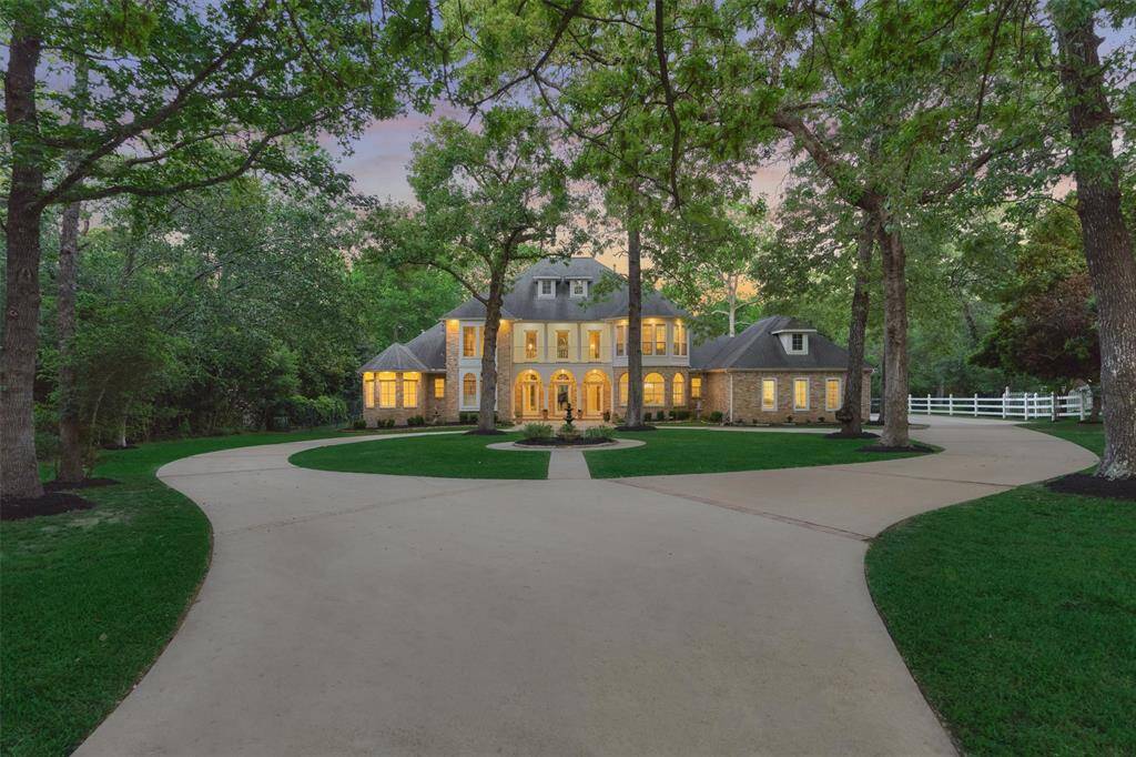 Rich with timeless appeal and charm, this extraordinary custom estate home will charm your senses with the setback from the road for extra privacy, and tranquil water views out back with no rear neighbor except wildlife!