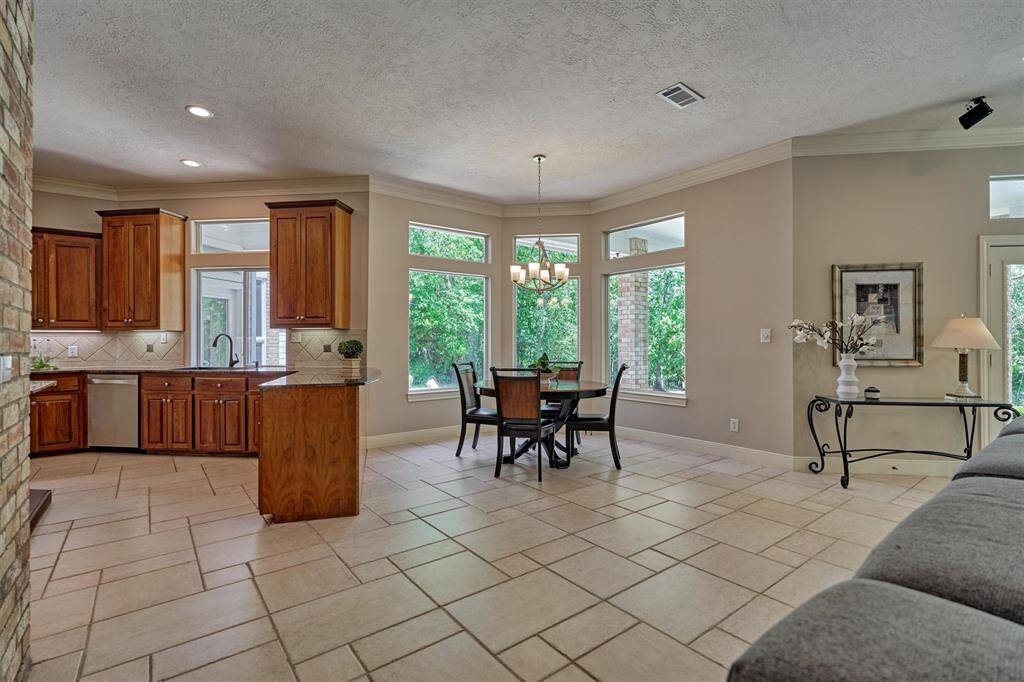 Breakfast room and kitchen adjoin the den.