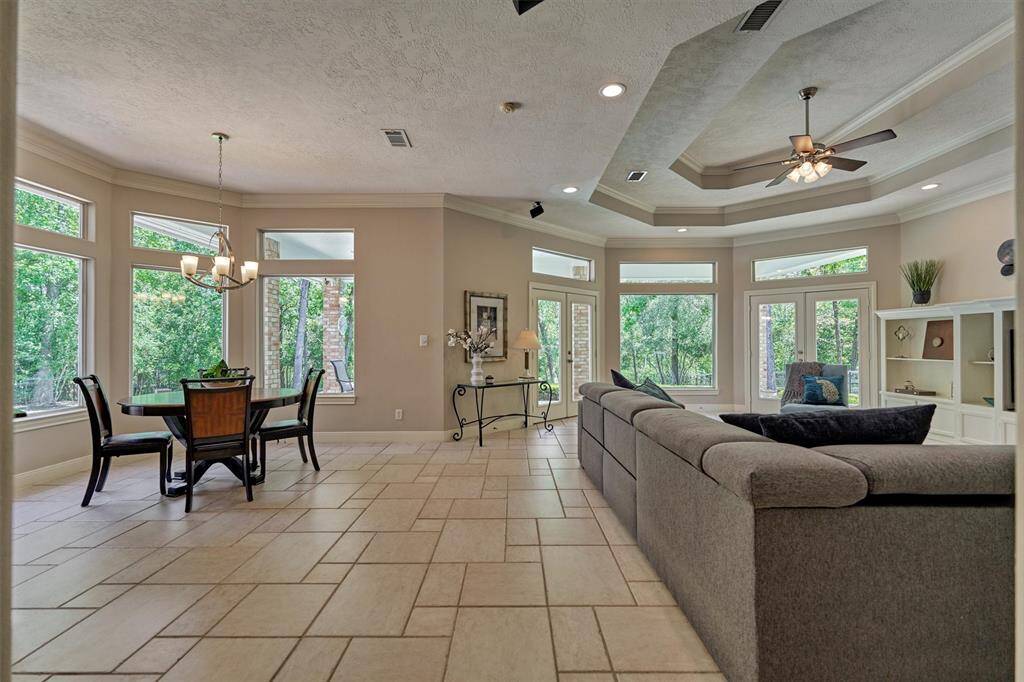 Expansive surrounding views of the tranquil backyard from the open great room with windows galore!