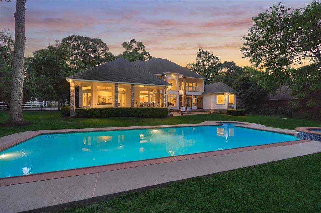 An expansive outdoor veranda, screened-in patio and balcony, and panoramic views from interior living areas make this property sparkle in a resort-like setting!