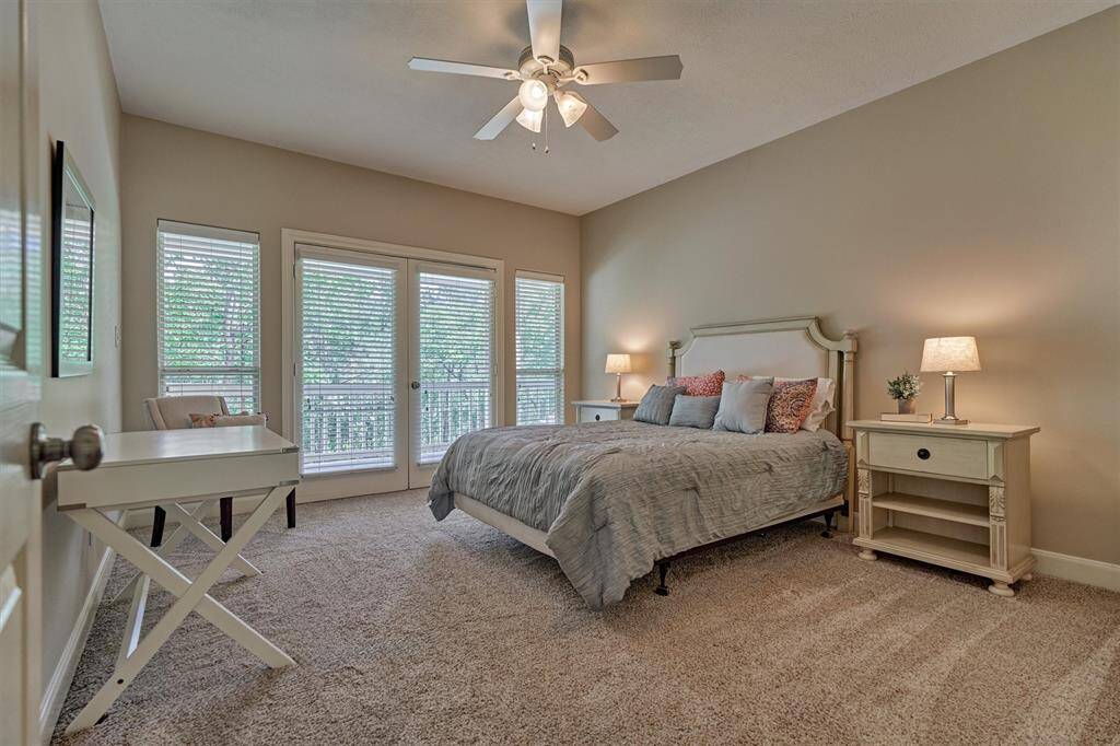 Secondary bedroom #2 is incredibly spacious with plush carpeting and private access to outdoor balcony!