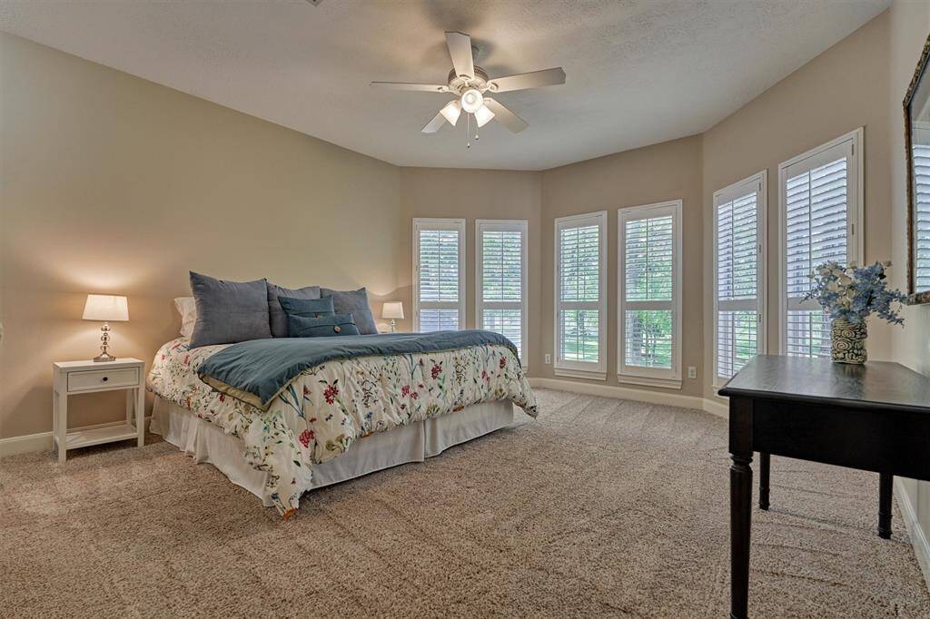 Secondary bedroom #3 is also incredibly spacious with plush carpeting and has a beautiful view from the windows! Note: plantation shutters.