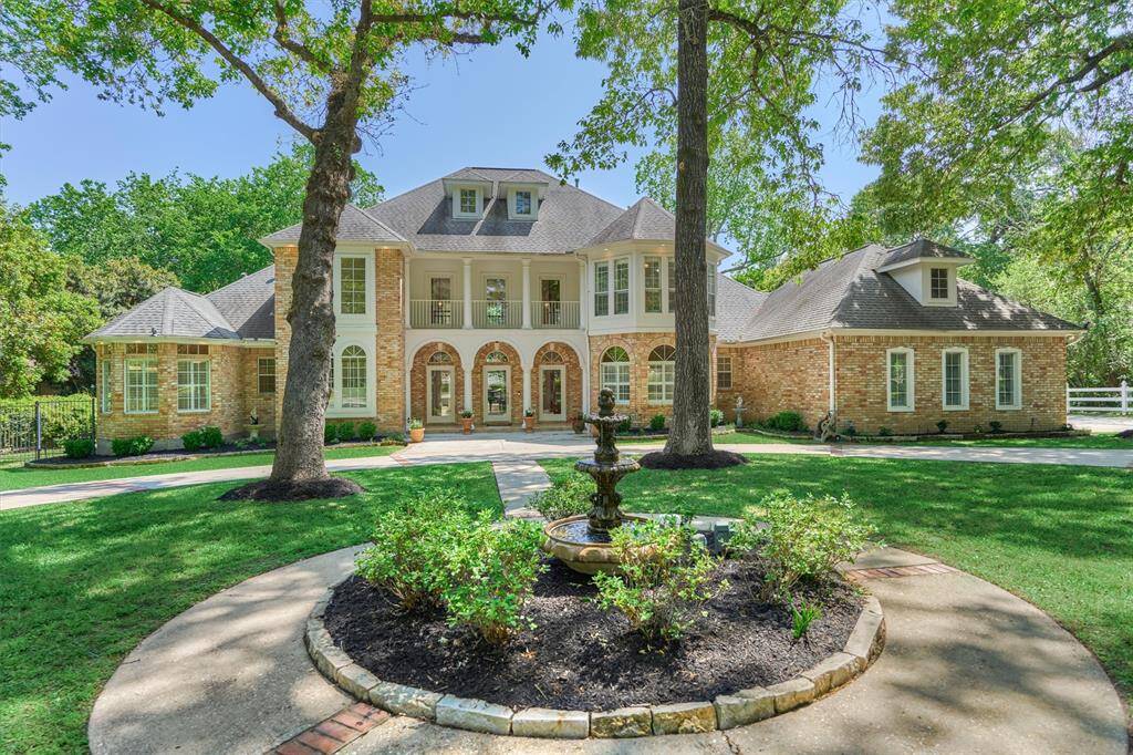 Impressive curb appeal with a beautiful fountain as a focal point.