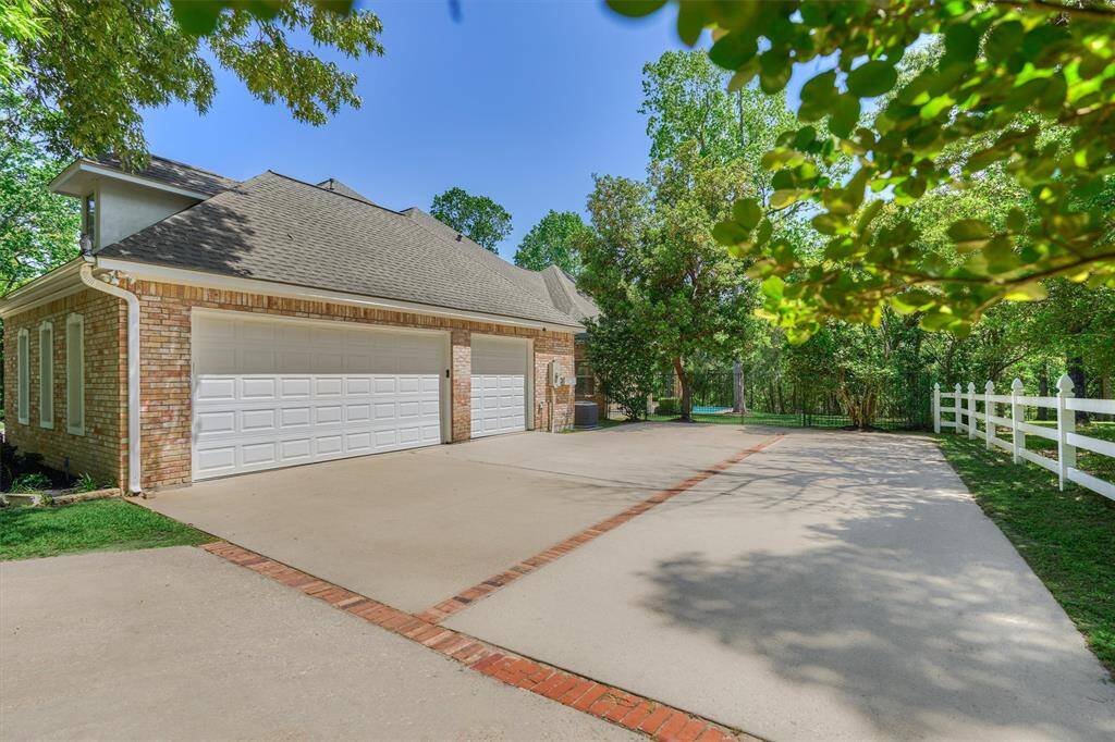 Idyllic side-entry garage with extra-large driveway pad for easy turn radius and/or additional parking!