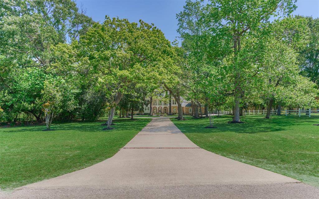 A gorgeous custom estate awaits you beyond this majestic, long, treelined driveway! Welcome home to exquisite 2318 Blue Lake Drive in coveted Montgomery Trace community - minutes to popular amenities in North Houston!