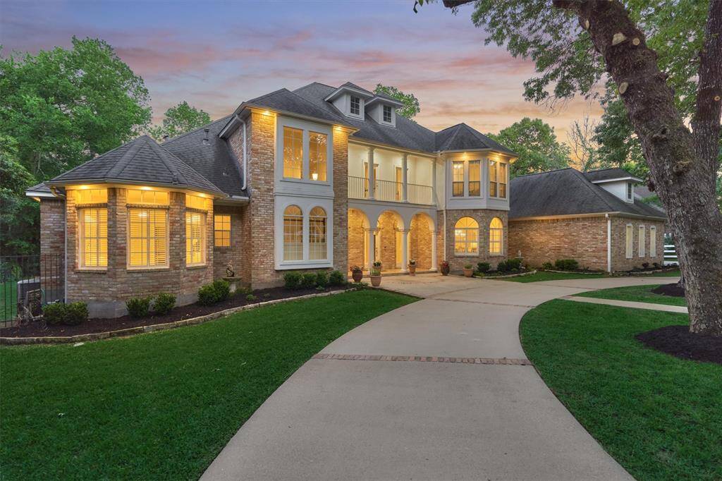 Warm and inviting with a premium circle drive and elevation with side garage entry plus large motor court - WOW!