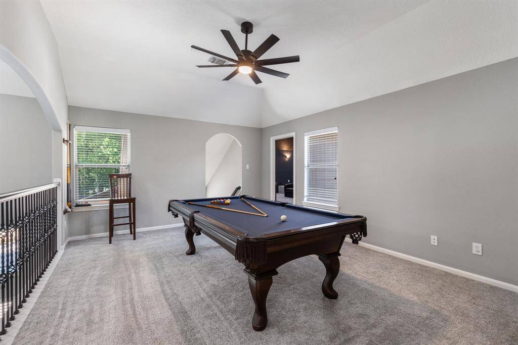 Light and bright gameroom upstairs complete with a newly surfaced pool table.