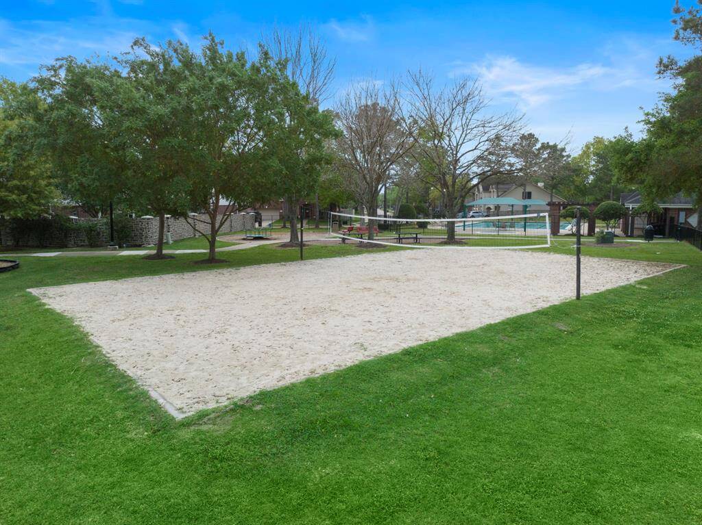 Enjoy the vibrant community amenities in Falcon Landing, featuring a well-maintained sand volleyball court for active recreation. The nearby clubhouse and pool offer additional leisure options, creating a welcoming environment for outdoor fun and relaxation.
