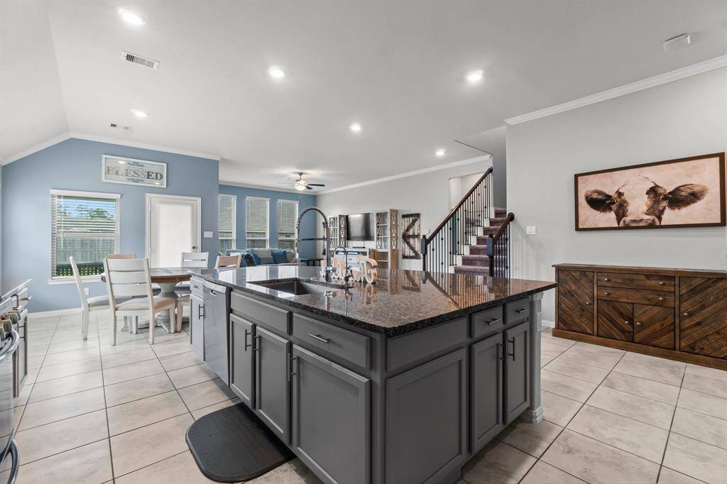 Large Island kitchen with granite counter tops and large sink