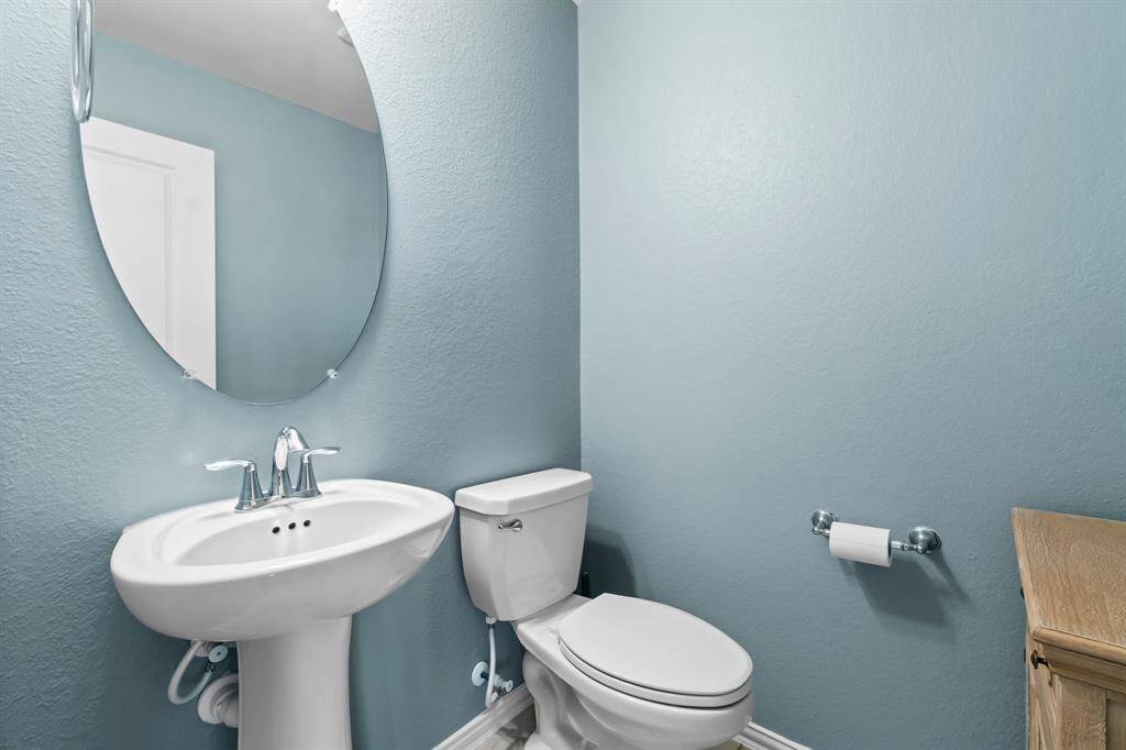 Powder bath upstairs next to game room