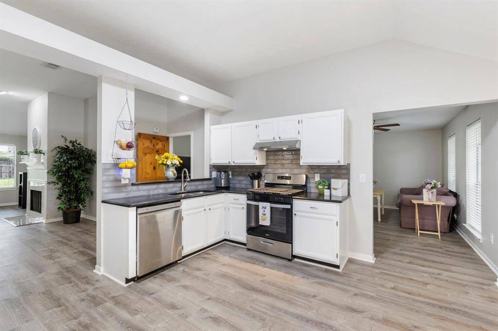 Enjoy cooking in the beautifully renovated kitchen, featuring sleek new stainless steel appliances - including a sought-after gas range!