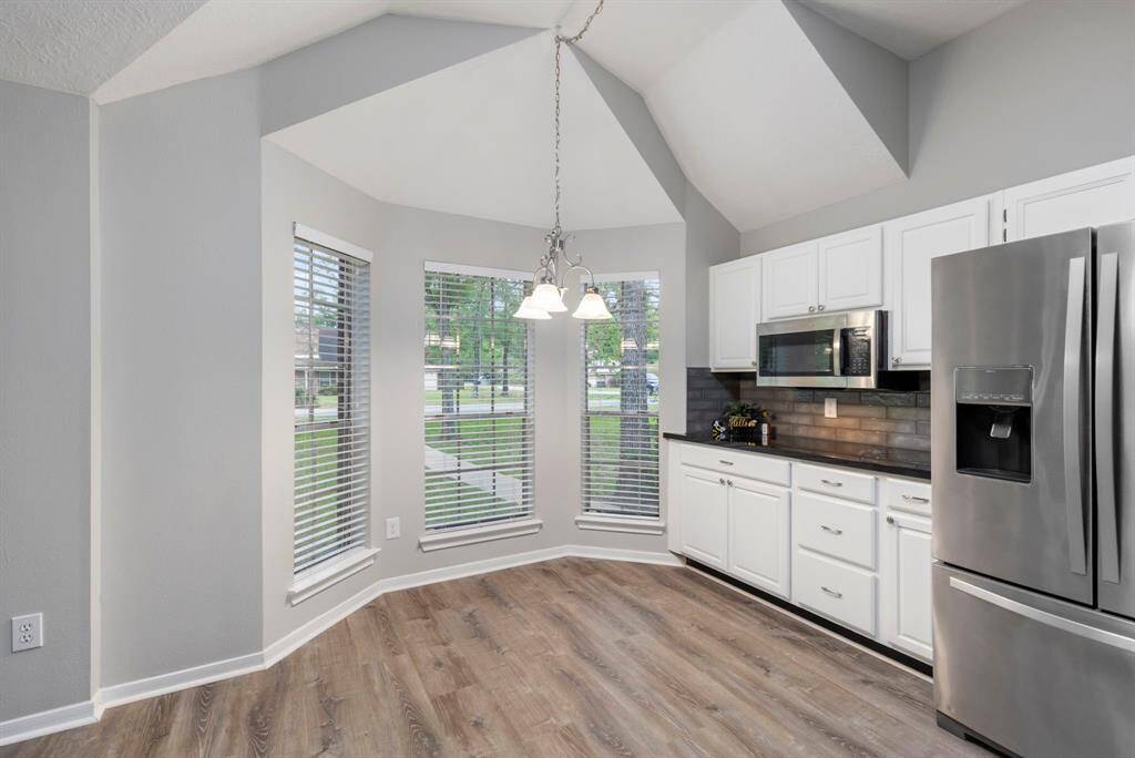 Take in the thoughtful architectural touches, such as the eye-catching ceiling angles and the stylish new faux wood blinds that adorn every window.