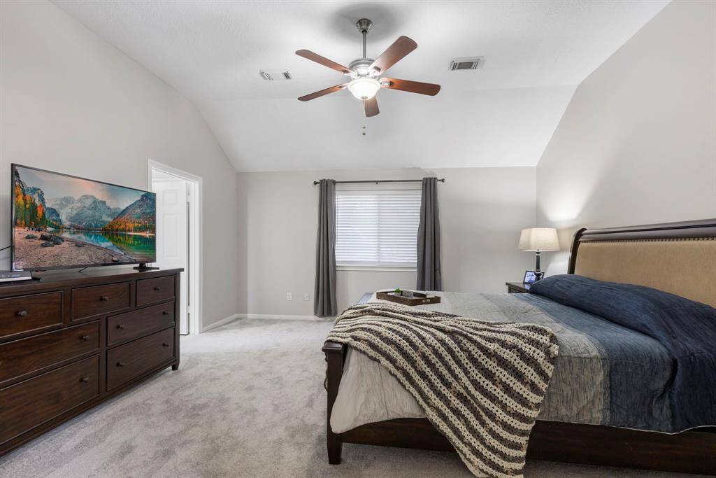 Enjoy the comfort of the spacious primary retreat, complete with new plush carpet, fresh paint, and a stylish new ceiling fan!