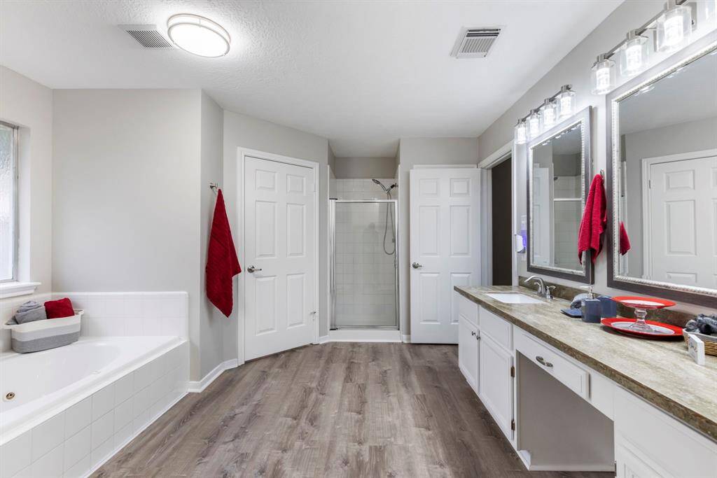 Step into the tastefully updated primary bathroom, designed to offer a lavish retreat!