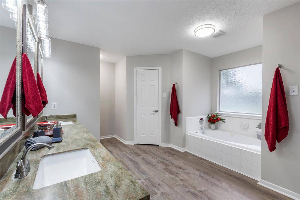 The primary retreat boasts two closets, including a roomy walk-in that’s directly connected to the bathroom for easy access.