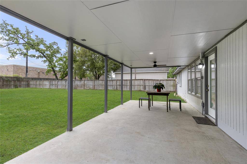 Imagine hosting family get-togethers, firing up the grill, and enjoying the great outdoors—all from the comfort of this covered patio!