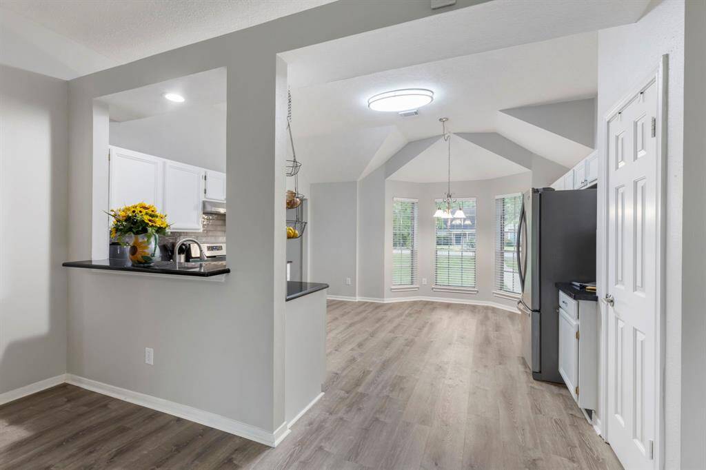 The cozy breakfast bar offers a convenient spot for quick bites or morning coffee.