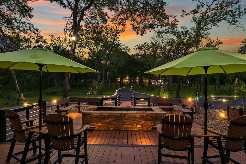 An impressive fire pit is one of many focal points, including the large deck and sleek railing. Wifi has been extended and can be accessible throughout the vast property.
