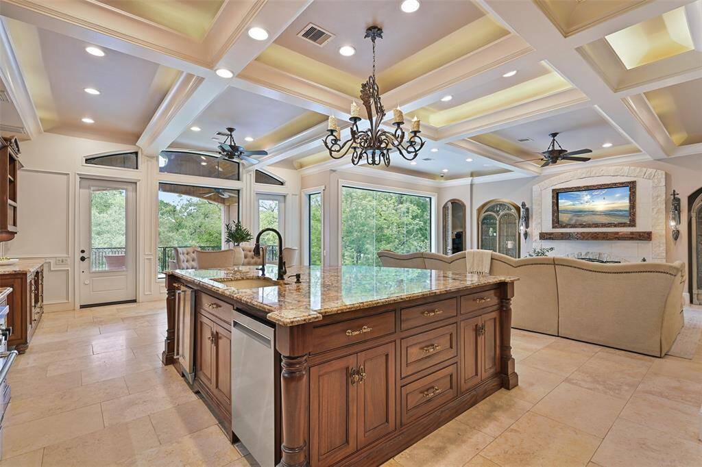 The island provides an immense amount of counter space, cabinetry, built-in dishwasher and separate ice maker.