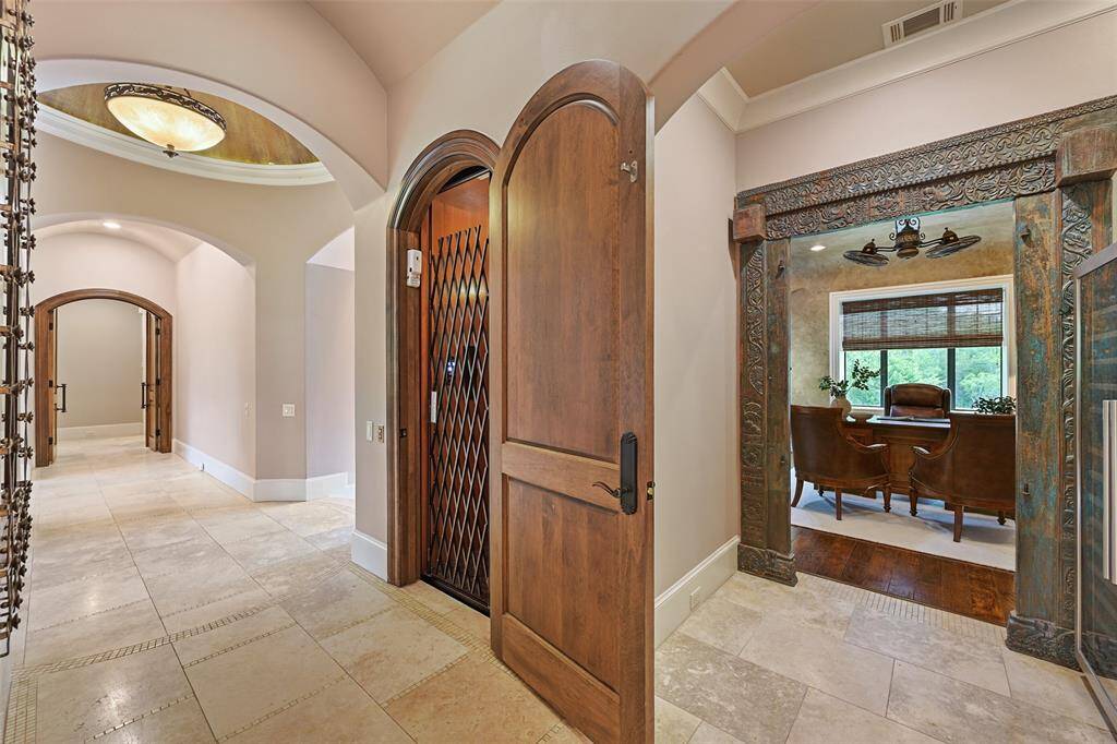 Off of the main entry and located in the main hall, an elevator provides access to the all house levels, including the extensive upstairs attic space.