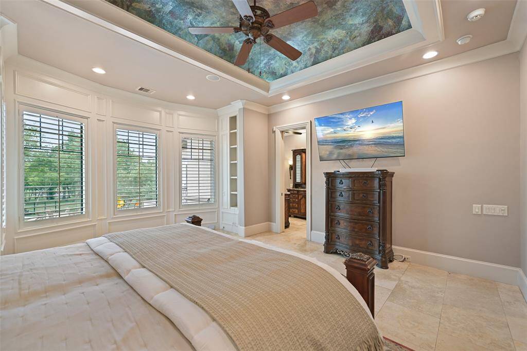 View from the primary bedroom looking towards the opulent ensuite bath.