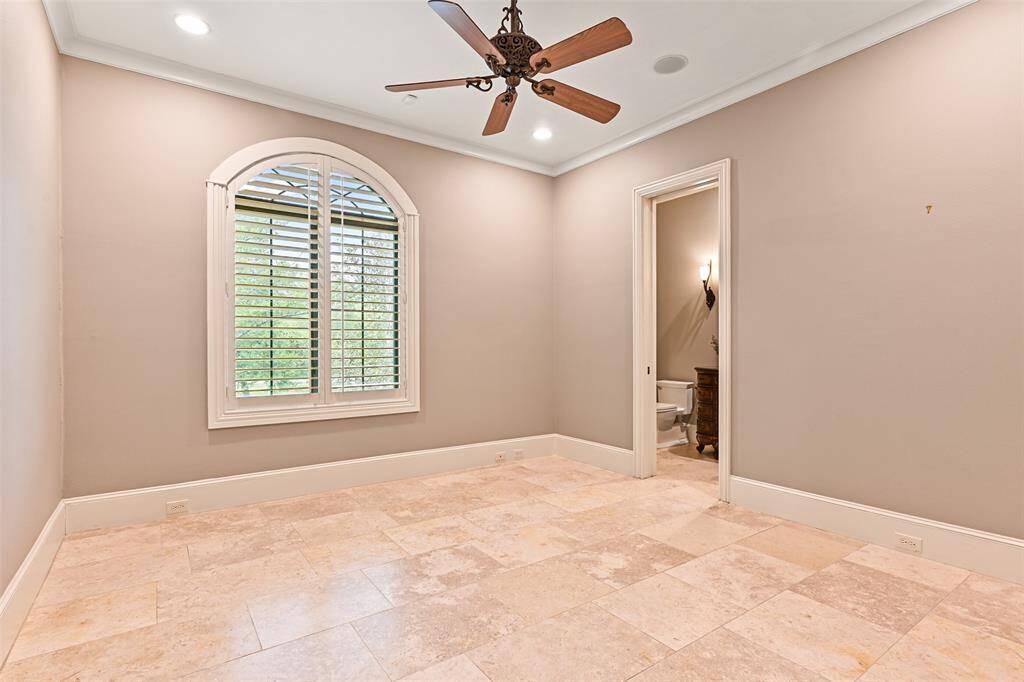 The 2nd ensuite secondary bedroom hosts beautiful views of the front lawn and treetops. Also featuring it's own private bath and walk-in closet.