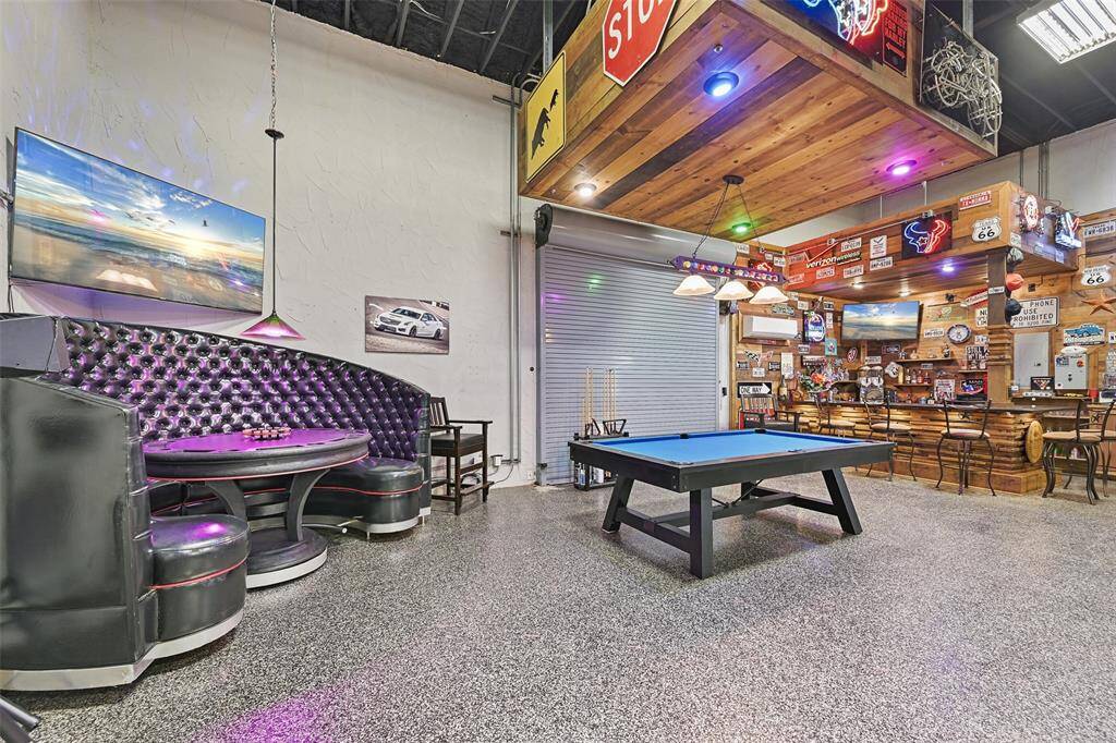 The entertaining side of the auxiliary building can host large parties and functions with commercial quality bar, multiple seating areas, LED lighting, multiple wall mounted tvs, pool table, foos ball, air hockey and shuffle board tables can be included.