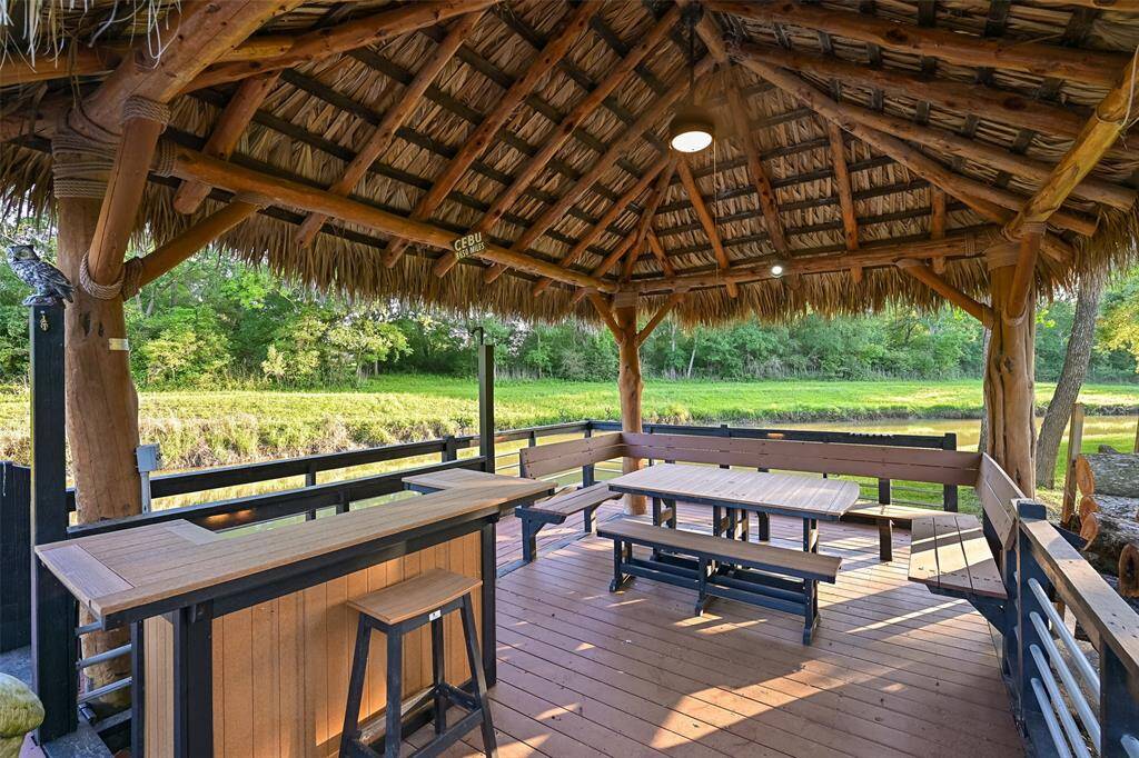 An incredible waterfront palapa equipped with electric, wifi-extender, water, built-in bench seating, bar area, fishing rod holders and outdoor fan.