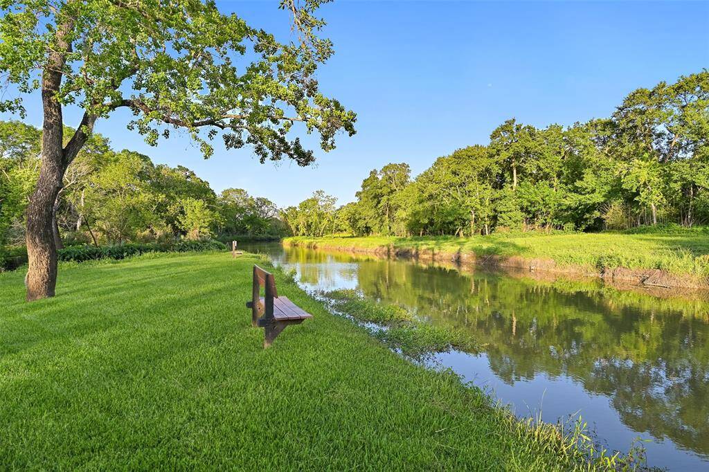Park bench seating along Chigger Creek attribute to the park-like and serene setting. Enjoy the serene setting, sounds of nature and wildlife that the area has to offer.