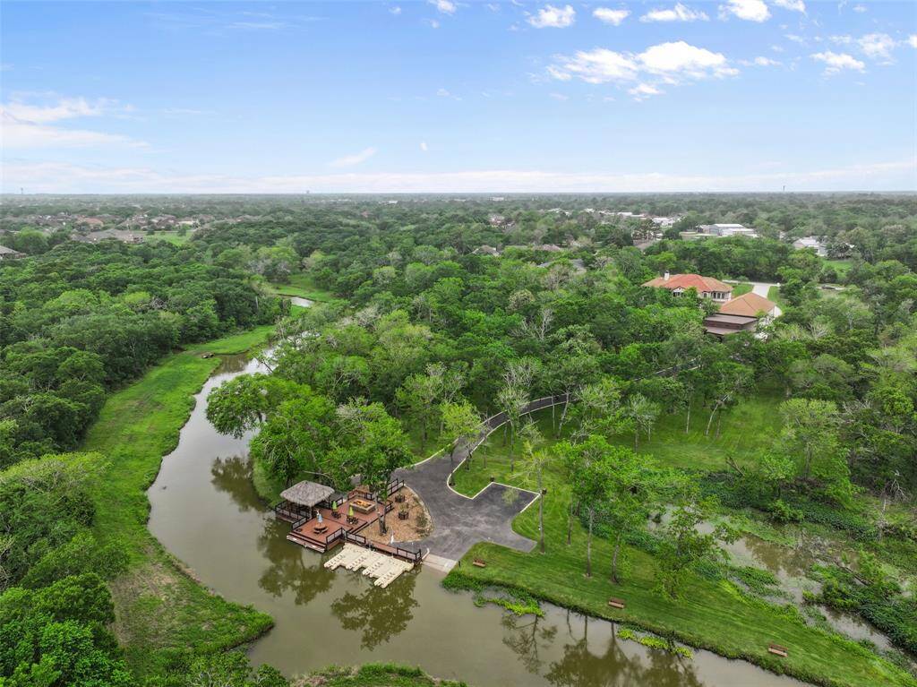 A rare opportunity to own nearly 3.8 acres along Chigger Creek in Polly Ranch Estates. A true entertainer & water enthusiast's paradise with incredible potential to host grand events and get-togethers. Located in an Aviation neighborhood with it's own private airstrip and located in the highly acclaimed FISD.