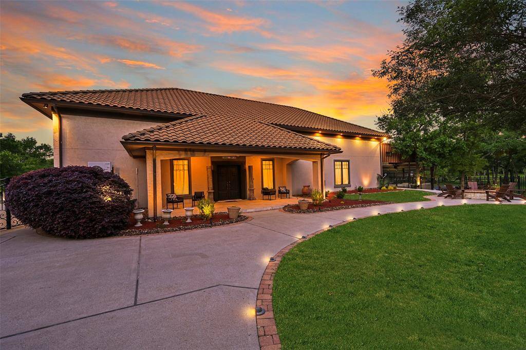 The separate 3200 square foot auxiliary building features matching exterior aesthetics to the home with concrete exterior, concrete tile roof and copper downspouts. Insulated and wired to the same security system as the main home & is cooled by 2 mini-split AC systems.