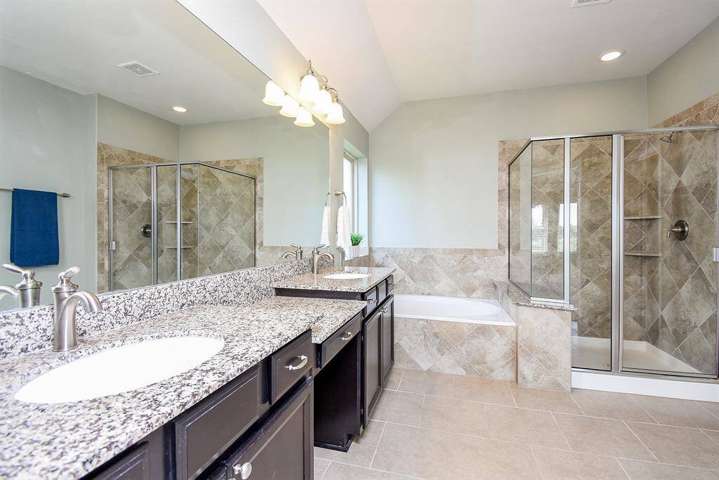 Best of both worlds, a soaking tub and a shower with seated bench.
