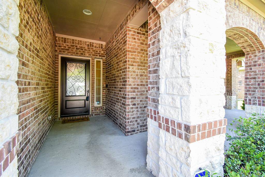 Stone and brick accents on all four sides with multiple covered areas to relax under