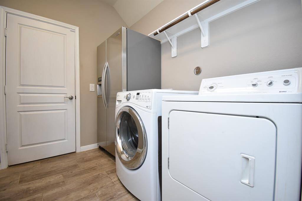 Nice sized laundry room that leads you into the 3 car Epoxy garage!
