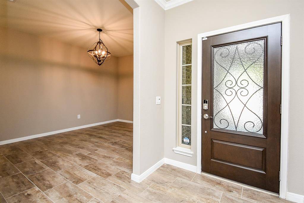 Elegant entry with updated light fixtures