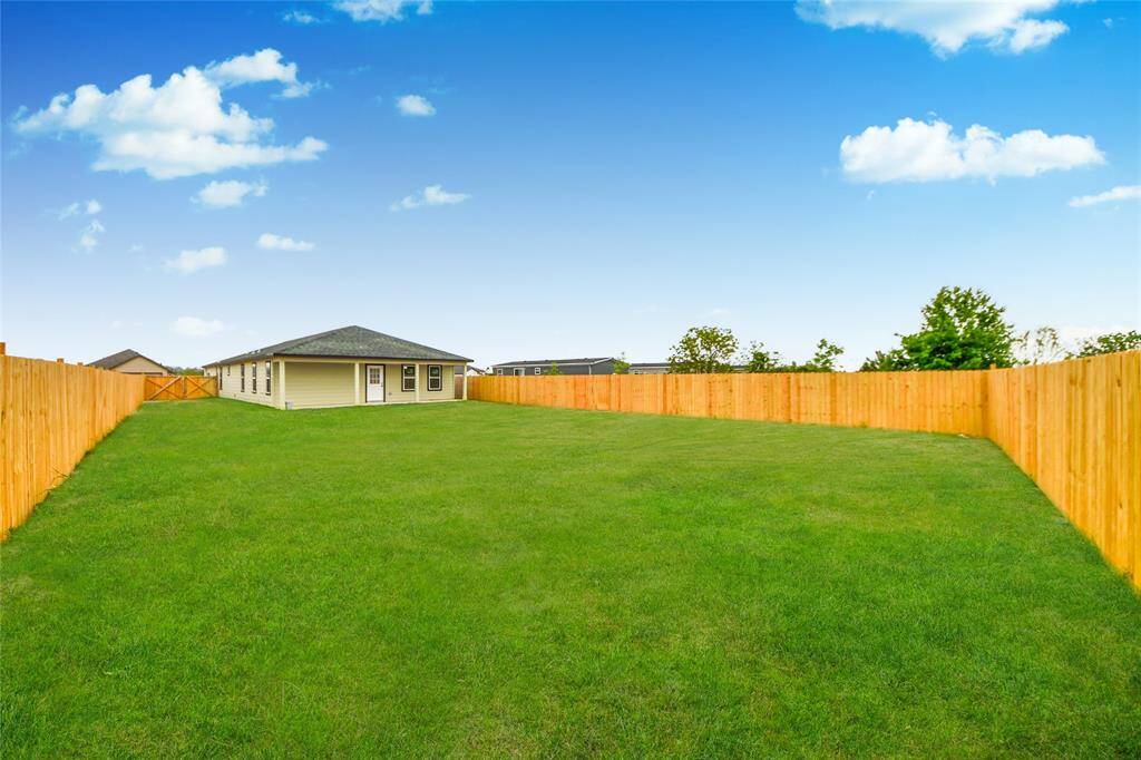Massive fully fenced backyard, perfect for outdoor entertaining, pets, or even a future pool.