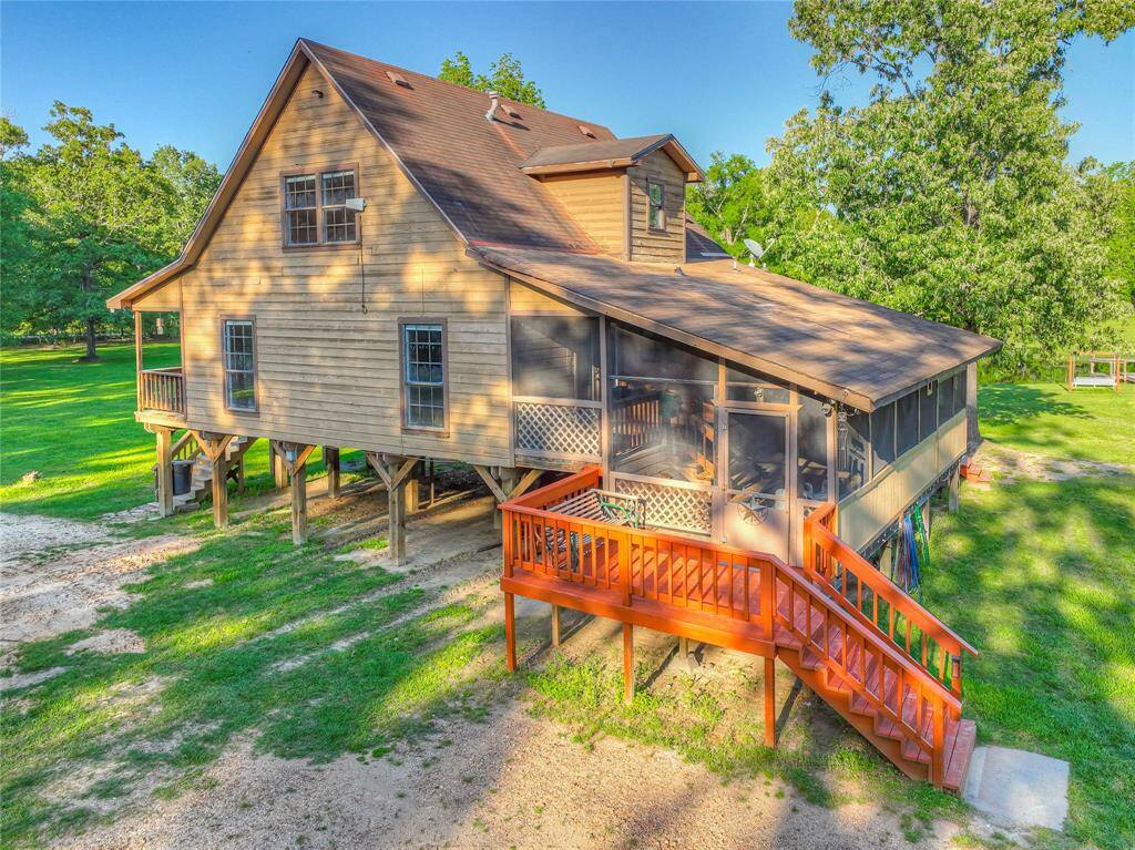 Side of house with screened in back porch/man cave