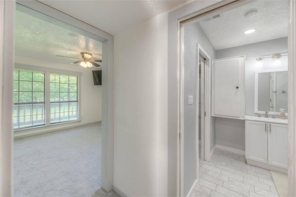 Peak into primary bedroom & primary bath.