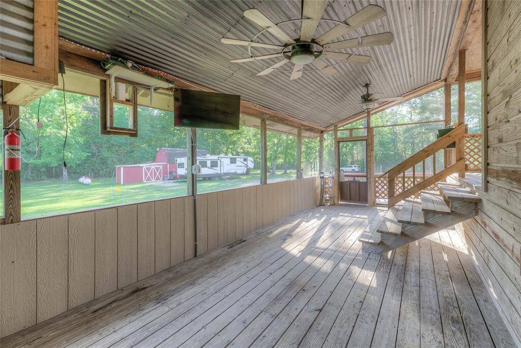Side/back door coming into screened in porch/man cave area.