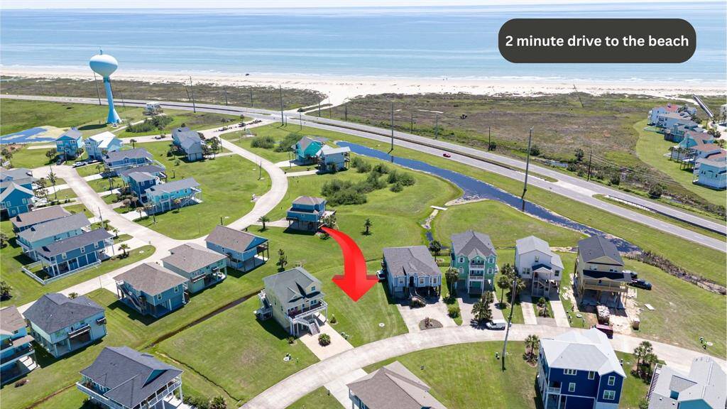 Here, the property is shown against the backdrop of the nearby shoreline—a beautiful reminder of the coastal lifestyle waiting to unfold.
