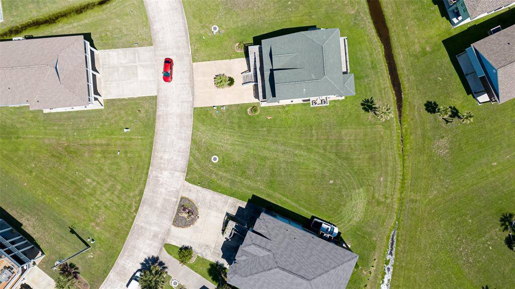 A clean overhead view, free of outlines, letting the landscape speak for itself—a canvas framed by greenery and light.