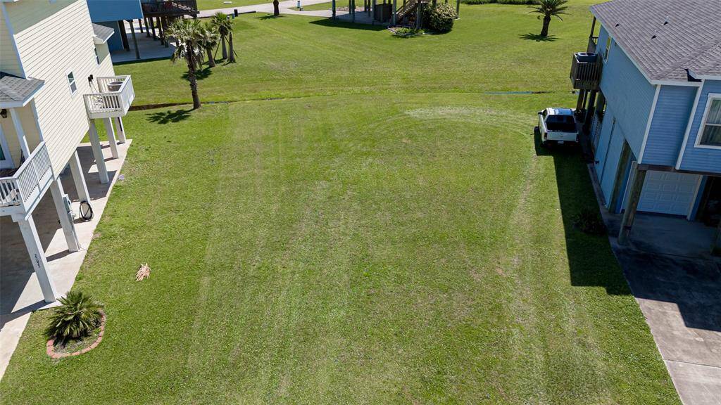 From a slightly elevated angle, this final close-up aerial reveals the trimmed expanse of the lot—level, sunlit, and full of promise.