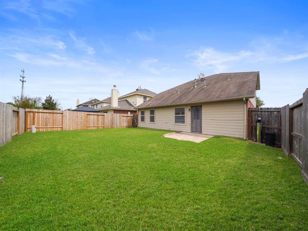 Huge backyard with new fences on the right.