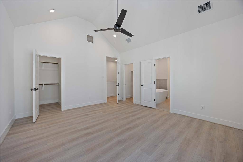 Primary bedroom with 2 walk in closets