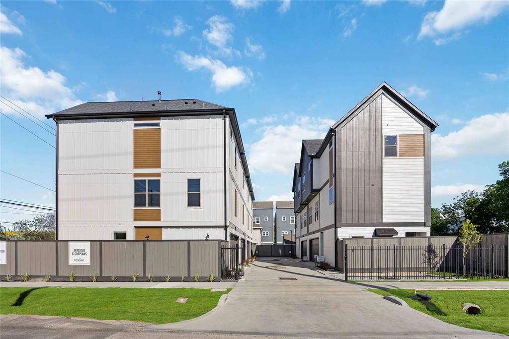 Sleek three-story townhomes nestled in vibrant harmony