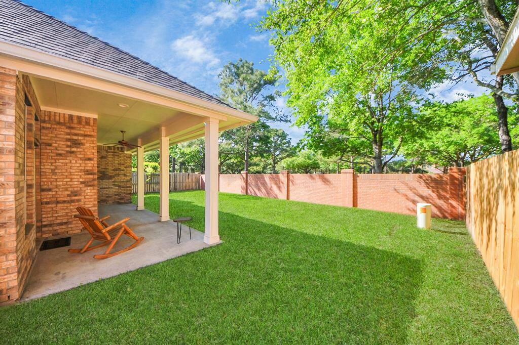 This inviting backyard features a spacious covered patio, providing a versatile space for both entertaining and tranquil outdoor living. Adjacent to the patio, a generously sized area awaits your green thumb—perfect for cultivating a vibrant vegetable garden or creating a stunning rose sanctuary.