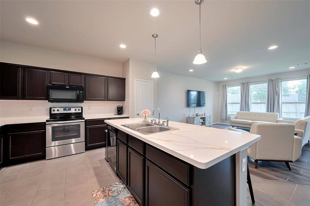 Spacious Kitchen with island overlooking the family room.