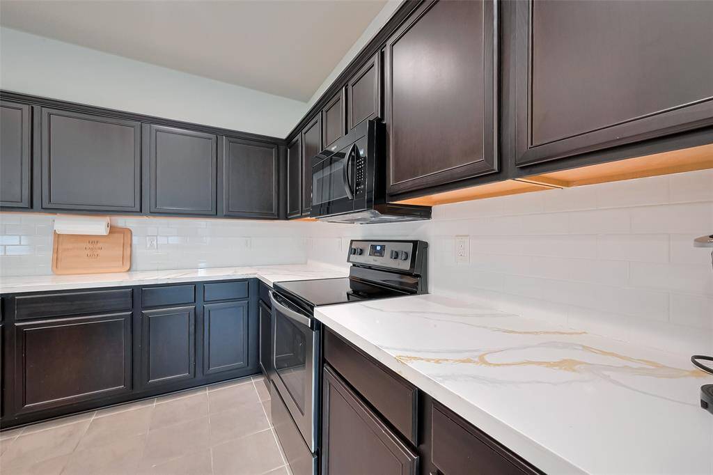 Upgraded quartz countertops on large island.