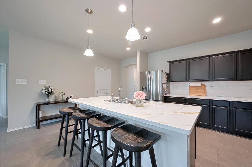 Beautiful new kitchen backsplash with modern white tile.